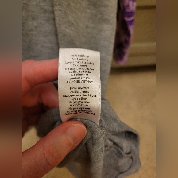 LulaRoe Disney Raglan Top featuring Purple Donald Duck Sleeves - Picture 2 of 5